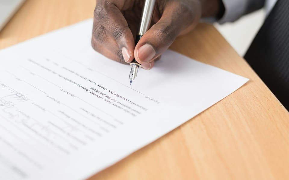 A person signing a property document