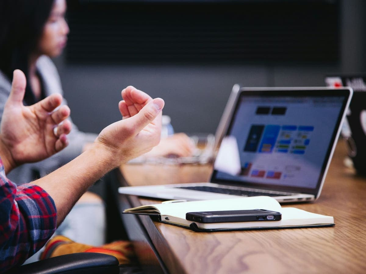 A property advisor discussing options with a client over a laptop